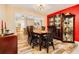 Dining area with a wood table and chairs, offering a view into the kitchen at 894 Quarters Ct, Port Orange, FL 32129