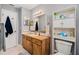 Clean bathroom with wood vanity, toilet and additional storage at 894 Quarters Ct, Port Orange, FL 32129