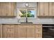 Bright kitchen with granite countertops and modern wood cabinets at 894 Quarters Ct, Port Orange, FL 32129