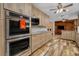Updated kitchen with stainless steel appliances and wood cabinets at 894 Quarters Ct, Port Orange, FL 32129