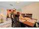 Dining room with a wood table, chairs and view into the living room at 894 Quarters Ct, Port Orange, FL 32129