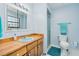 Clean bathroom with light blue tile and a vanity at 894 Quarters Ct, Port Orange, FL 32129