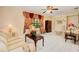 Living room with tiled floor, featuring a comfortable seating area and large window at 894 Quarters Ct, Port Orange, FL 32129