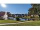 Tranquil lake with fountain in the center of the community at 4400 Thornbriar Ln # A202, Orlando, FL 32822