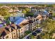 Aerial view of community, showcasing buildings and lake at 4400 Thornbriar Ln # A202, Orlando, FL 32822
