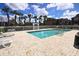 Community pool with lounge chairs and brick pavers at 4400 Thornbriar Ln # A202, Orlando, FL 32822