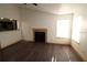 Living room with laminate wood floors and fireplace at 4400 Thornbriar Ln # A202, Orlando, FL 32822