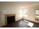Living room with fireplace and plenty of natural light at 4400 Thornbriar Ln # A202, Orlando, FL 32822