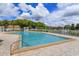 Inviting community swimming pool with a spacious deck at 4400 Thornbriar Ln # A202, Orlando, FL 32822