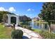 Community features a serene lake with walking paths and beautiful landscaping at 4400 Thornbriar Ln # A202, Orlando, FL 32822