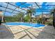 Relaxing freeform pool with a screened enclosure at 16328 Wind View Ln, Winter Garden, FL 34787