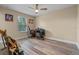 Bright bedroom with wood floors, perfect for a music studio or office at 16328 Wind View Ln, Winter Garden, FL 34787