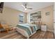 Bright bedroom with wood-look floors and a comfortable sitting area at 16328 Wind View Ln, Winter Garden, FL 34787