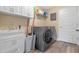 Convenient laundry room with washer, dryer, and extra storage at 16328 Wind View Ln, Winter Garden, FL 34787