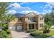 Two-story house with solar panels and a three-car garage at 16328 Wind View Ln, Winter Garden, FL 34787