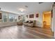 Spacious game room with comfortable seating and large windows at 16328 Wind View Ln, Winter Garden, FL 34787