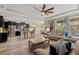 Open floor plan with stainless steel appliances and light flooring at 16328 Wind View Ln, Winter Garden, FL 34787
