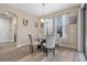Bright dining area with glass table and four chairs at 16328 Wind View Ln, Winter Garden, FL 34787