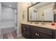 Double vanity bathroom with a large mirror and plenty of counter space at 16328 Wind View Ln, Winter Garden, FL 34787