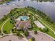 Resort-style community pool, clubhouse, playground, and sand volleyball court at 16328 Wind View Ln, Winter Garden, FL 34787