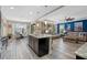 Open concept kitchen with granite island, stainless steel appliances, and breakfast bar at 16328 Wind View Ln, Winter Garden, FL 34787