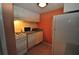 Small kitchen with white cabinets and appliances at 103 Oyster Bay Cir # 120, Altamonte Springs, FL 32701