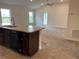 View of kitchen, living room, and back door from kitchen island at 4306 Sagefield Dr, Harmony, FL 34773