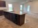 Kitchen island with double sink, dishwasher, and granite countertop at 4306 Sagefield Dr, Harmony, FL 34773