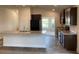 Modern kitchen with dark cabinetry, island, and stainless steel appliances at 4306 Sagefield Dr, Harmony, FL 34773