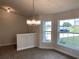 Bright dining room with chandelier and large window at 4306 Sagefield Dr, Harmony, FL 34773