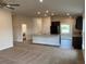 Open concept kitchen with island and laundry access at 4306 Sagefield Dr, Harmony, FL 34773