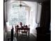 Charming dining area with table and chairs, overlooking a lush yard at 4113 Enchanted Oaks Cir # 1216, Kissimmee, FL 34741