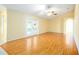 Spacious living room featuring laminate wood floors and a ceiling fan at 1691 Parkglen Cir, Apopka, FL 32712