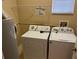 Laundry room with washer, dryer, and utility sink at 14460 Clarkson Dr, Orlando, FL 32828