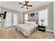 Main bedroom with king bed and access to balcony at 364 Muirfield Loop, Reunion, FL 34747