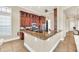 Modern kitchen with granite countertops and stainless steel appliances at 364 Muirfield Loop, Reunion, FL 34747
