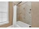 Bathroom with shower/tub combo and diagonal tile at 364 Muirfield Loop, Reunion, FL 34747