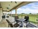 Relaxing balcony with patio furniture and scenic golf course views at 364 Muirfield Loop, Reunion, FL 34747