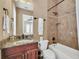 Small bathroom with single vanity and shower/tub combo at 364 Muirfield Loop, Reunion, FL 34747