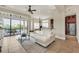 Open living space showcasing a white sofa, kitchen, and pool access at 364 Muirfield Loop, Reunion, FL 34747