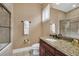 Clean bathroom with granite countertop, toilet and shower/tub combo at 364 Muirfield Loop, Reunion, FL 34747