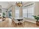 Breakfast nook with a round table and chairs, offering views of the pool area at 364 Muirfield Loop, Reunion, FL 34747