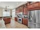 Spacious kitchen with ample cabinetry, granite counters, and stainless steel appliances at 364 Muirfield Loop, Reunion, FL 34747