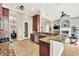 Modern kitchen with granite countertops and stainless steel appliances at 364 Muirfield Loop, Reunion, FL 34747