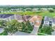 Luxury home with a tile roof nestled in a golf course community at 364 Muirfield Loop, Reunion, FL 34747