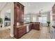 Spacious kitchen with granite countertops, stainless steel appliances, and ample cabinetry at 364 Muirfield Loop, Reunion, FL 34747