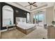 Main bedroom with a king-size bed, large windows, and access to the pool at 364 Muirfield Loop, Reunion, FL 34747