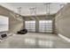 Spacious two-car garage with overhead storage and extra space at 364 Muirfield Loop, Reunion, FL 34747