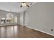 Bright and airy living room with large windows and wood floors at 1409 Sutton Island Dr, Deland, FL 32724