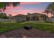 Large backyard with screened patio, brick pavers, and grassy lawn at 1409 Sutton Island Dr, Deland, FL 32724